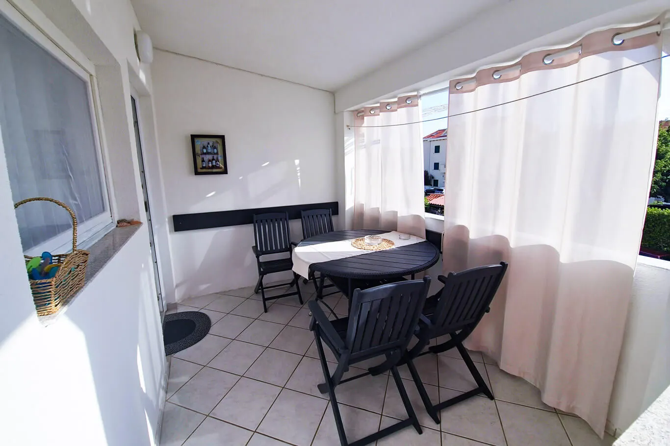 Teja, private covered balcony with a round dining set